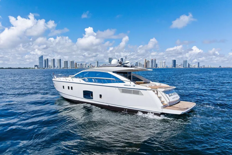 Slide: The Image of Luxury yacht Absolute 64 cruising on ocean, city skyline in background, 2013 model. - 5
