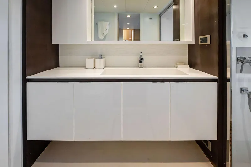 Slide: The Image of Modern bathroom vanity on Absolute 64 yacht, 2013 model, featuring sleek white cabinetry. - 50