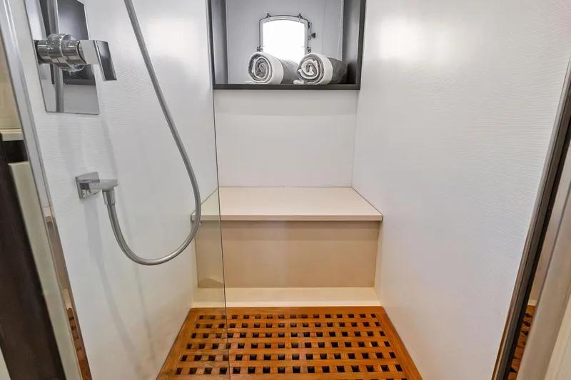 Slide: The Image of Modern shower area on 2013 Absolute 64 yacht with wooden floor and rolled towels. - 52
