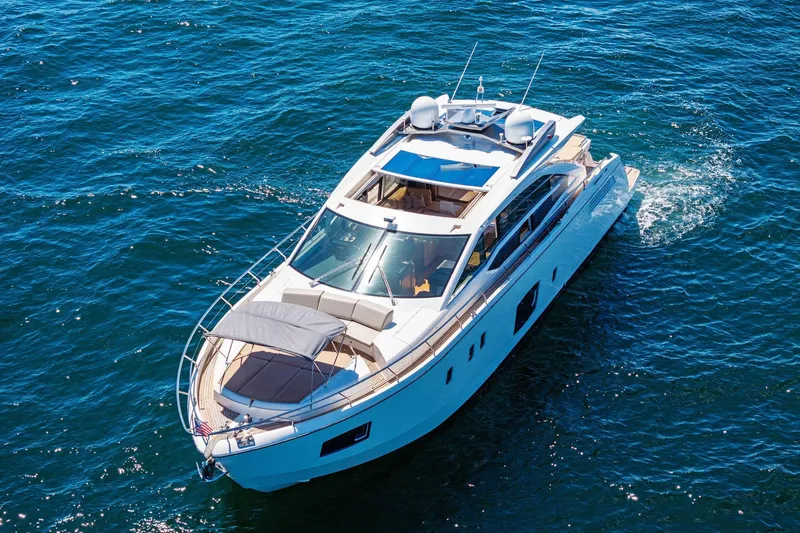 Slide: The Image of Luxurious 2013 Absolute 64 yacht cruising on open blue waters. - 59