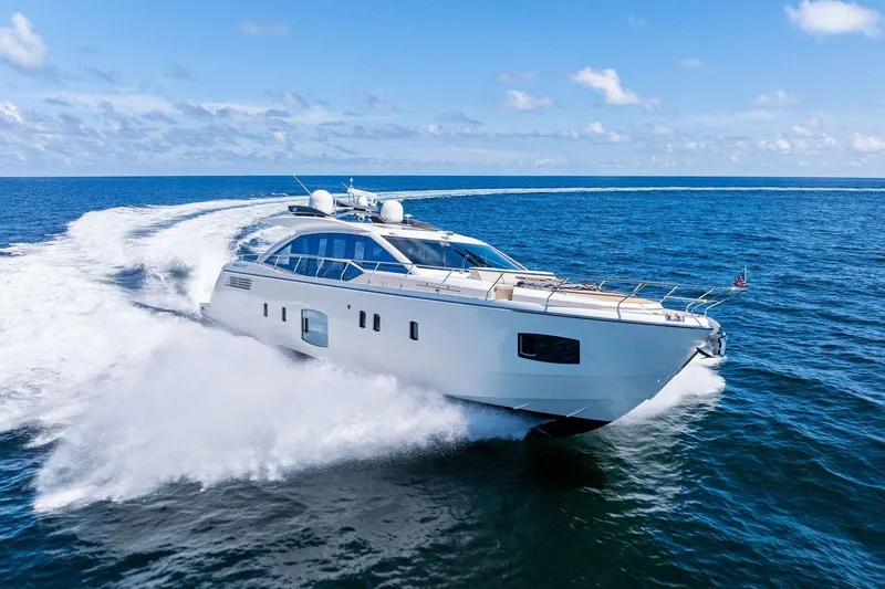 Slide: The Image of Luxurious 2013 Absolute 64 yacht cruising on open sea under clear blue sky. - 62