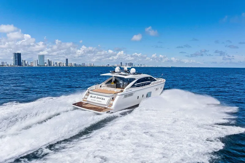 Slide: The Image of Luxury Absolute 64 yacht cruising on ocean near city skyline, 2013 model. - 63
