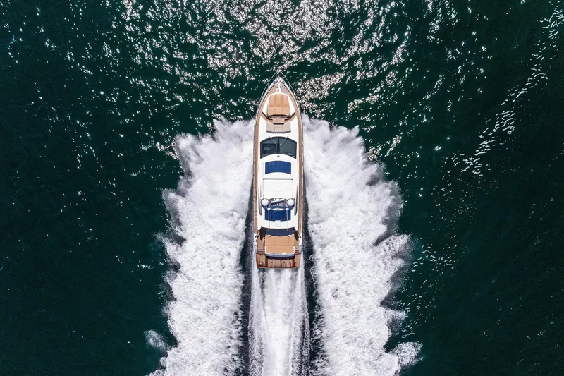 Slide: The Image of Aerial view of 2013 Absolute 64 yacht cruising on open water. - 66