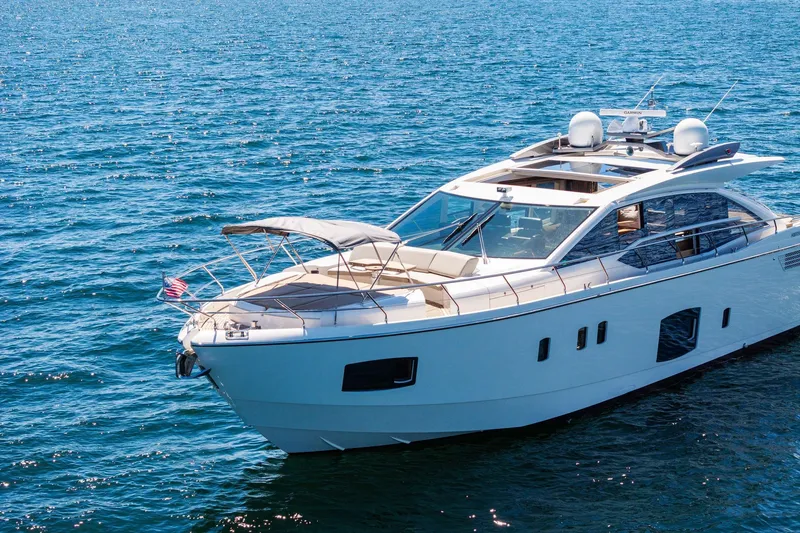 Slide: The Image of Luxurious 2013 Absolute 64 yacht cruising on open blue waters. - 9