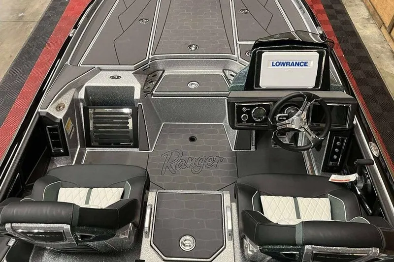 Slide: The Image of 2026 Ranger Z520R Cup-Equipped boat interior with Lowrance display and dual seats. - 3