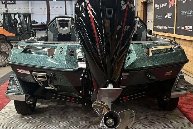 Slide: The Image of 2026 Ranger Z520R Cup-Equipped boat, rear view in showroom, showcasing sleek design and powerful engine. - 6