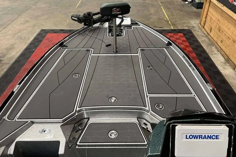 Slide: The Image of 2026 Ranger Z520R Cup-Equipped boat deck with Lowrance electronics, in a workshop setting. - 7