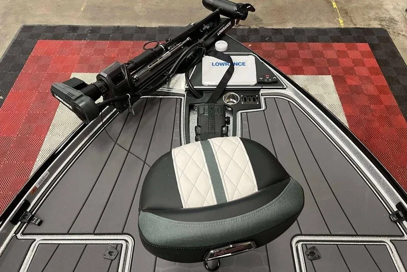 Slide: The Image of 2026 Ranger Z520R Cup-Equipped boat interior with Lowrance electronics and cushioned seat. - 8
