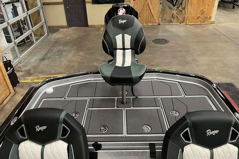 Slide: The Image of 2026 Ranger Z520R Cup-Equipped boat interior with stylish seating and deck design. - 9