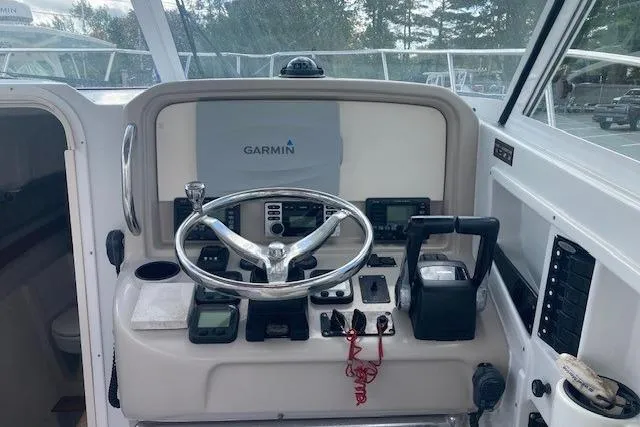 Slide: The Image of Helm of 2008 Glacier Bay 2685 Coastal Runner with Garmin navigation system. - 12