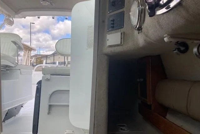 Slide: The Image of 2008 Glacier Bay 2685 Coastal Runner interior with seating and control panel. - 15