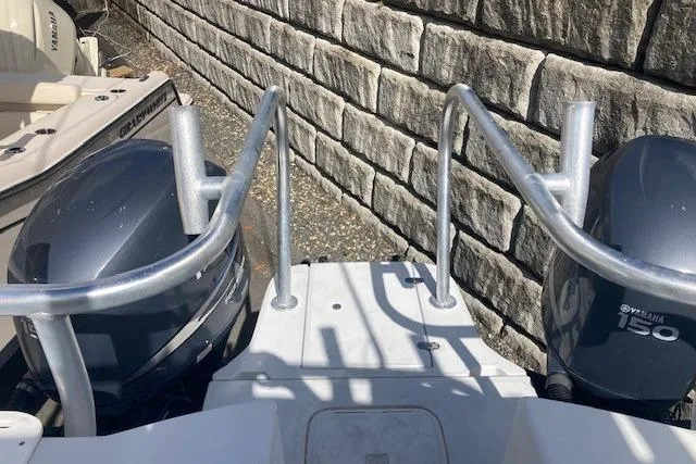 Slide: The Image of 2008 Glacier Bay 2685 Coastal Runner with dual Yamaha 150 engines, docked near stone wall. - 7