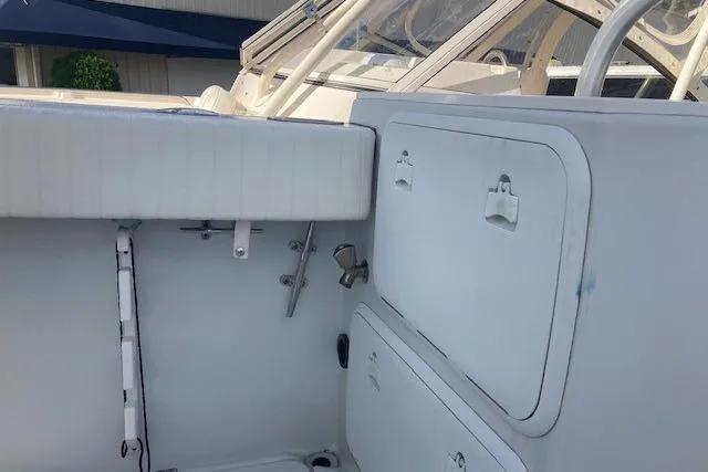 Slide: The Image of 2008 Glacier Bay 2685 Coastal Runner boat interior with storage compartments and seating. - 8