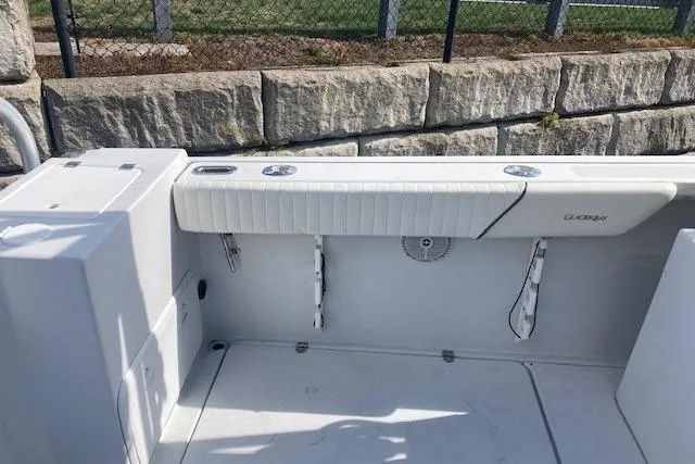 Slide: The Image of 2008 Glacier Bay 2685 Coastal Runner boat interior with seating and storage. - 9