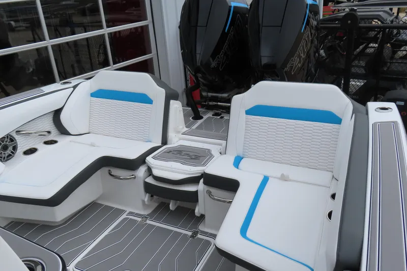 Slide: The Image of 2026 Sunsation 32CCX boat interior with white and blue seating, dual engines, and modern design. - 14