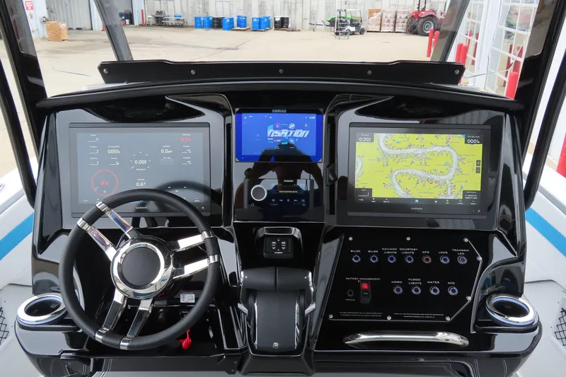 Slide: The Image of 2026 Sunsation 32CCX boat dashboard with advanced navigation and control systems. - 20