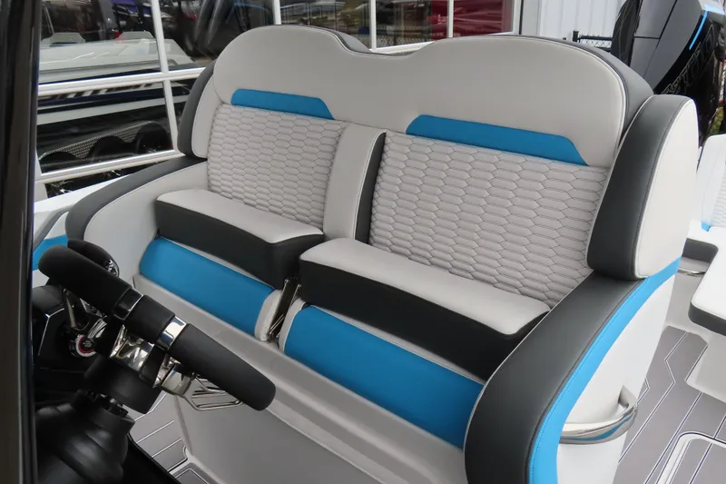 Slide: The Image of 2026 Sunsation 32CCX boat interior with modern blue and gray seating design. - 27