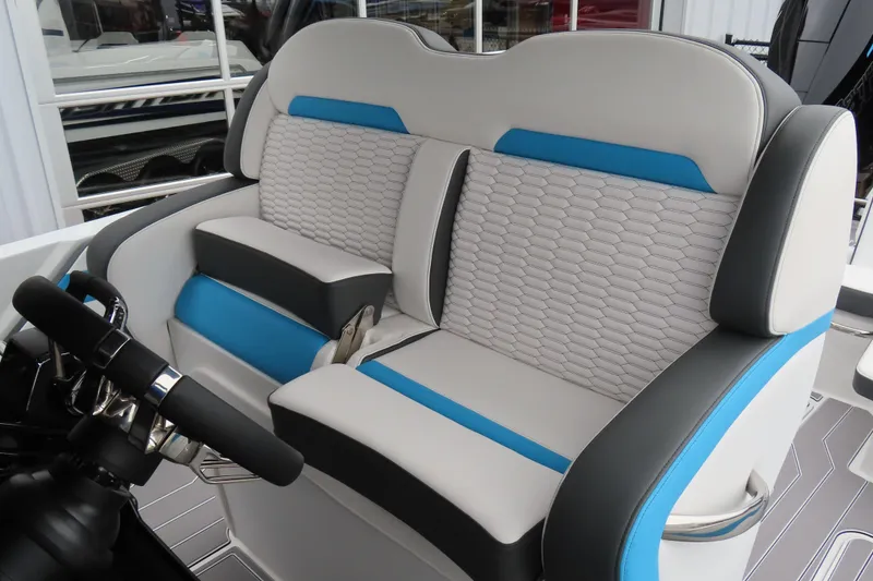 Slide: The Image of 2026 Sunsation 32CCX boat interior with stylish blue and gray seating. - 5