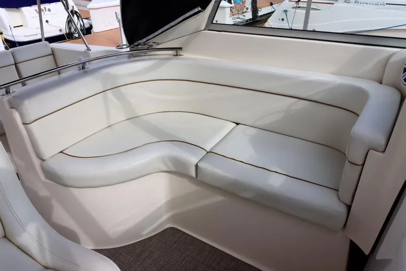 Slide: The Image of 2006 Rinker 360 Express Cruiser interior with white leather seating. - 9