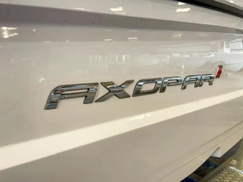 Slide: The Image of 2023 Axopar 22 T-Top boat logo on white hull - 14
