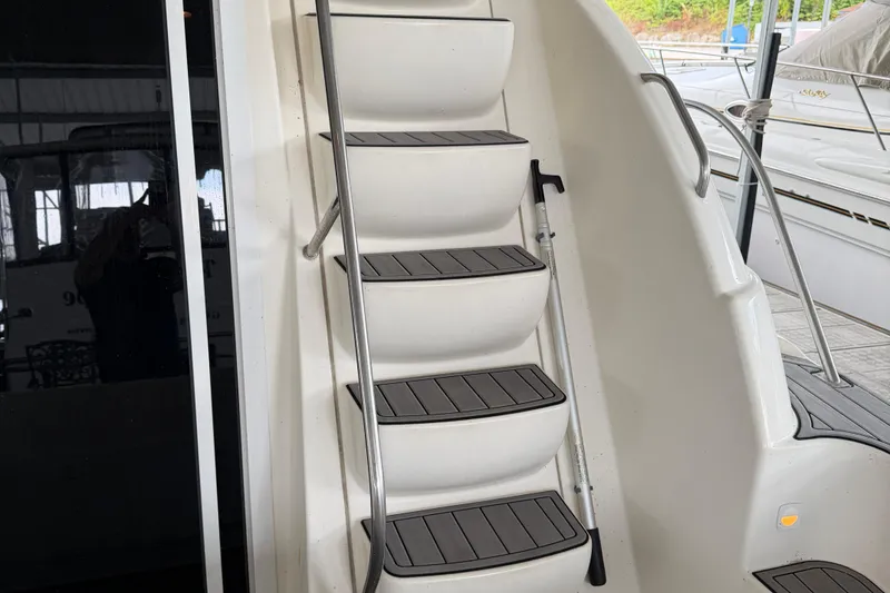 Slide: The Image of Staircase on a 2004 Meridian 341 Sedan yacht, featuring sleek design and modern materials. - 13