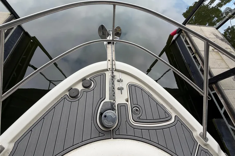 Slide: The Image of Bow of 2004 Meridian 341 Sedan yacht with stainless steel railings and anchor. - 16