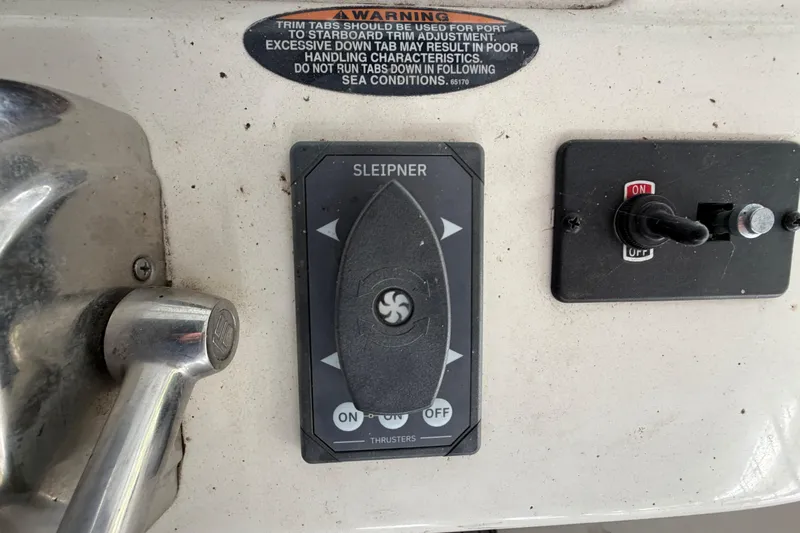 Slide: The Image of Control panel of a 2004 Meridian 341 Sedan boat with warning label and switches. - 20