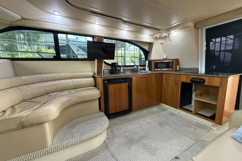 Slide: The Image of Luxurious interior of a 2004 Meridian 341 Sedan yacht with leather seating and modern kitchen amenities. - 26