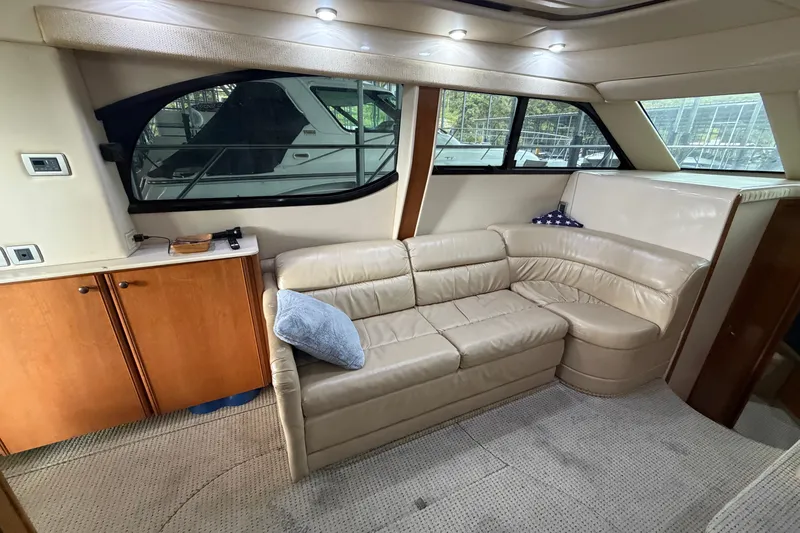 Slide: The Image of Luxurious interior of a 2004 Meridian 341 Sedan yacht with beige leather seating. - 28