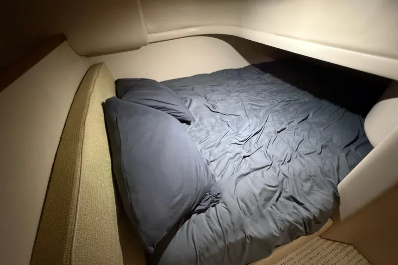 Slide: The Image of Cozy sleeping area in a 2004 Meridian 341 Sedan yacht cabin. - 34