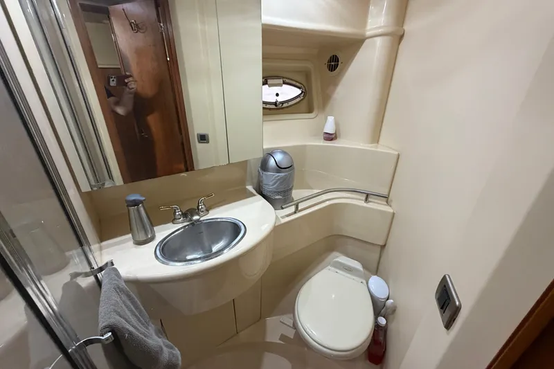 Slide: The Image of Compact bathroom in 2004 Meridian 341 Sedan yacht with sink, toilet, and mirror. - 35