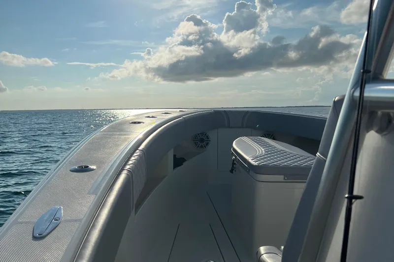 Slide: The Image of 2022 SeaVee 322 Z boat on open water under a cloudy sky. - 10