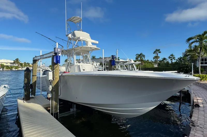 Slide: The Image of 2022 SeaVee 322 Z boat docked, featuring a sleek design and clear blue sky backdrop. - 11