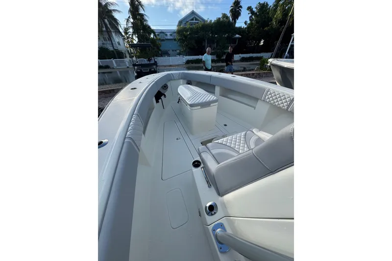 Slide: The Image of 2022 SeaVee 322 Z boat interior with cushioned seating and sleek design. - 20