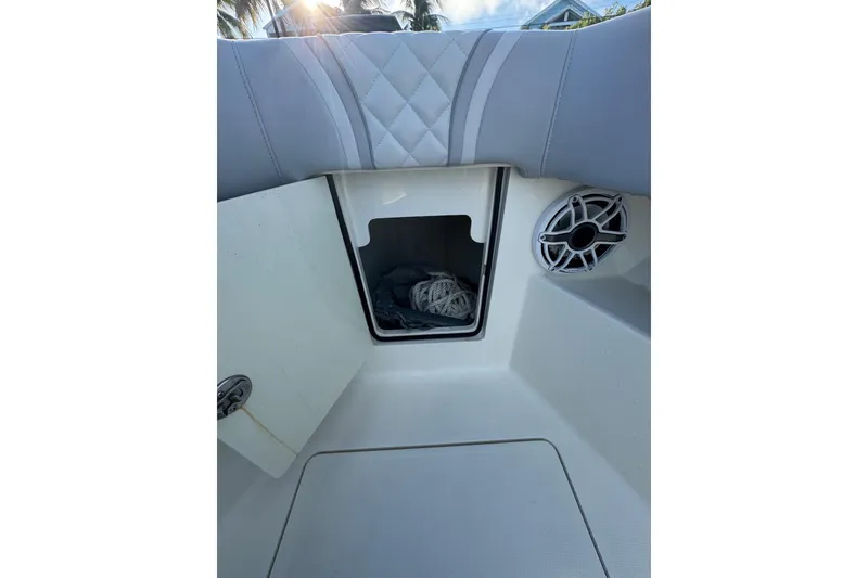 Slide: The Image of 2022 SeaVee 322 Z boat storage compartment with speaker and rope. - 21