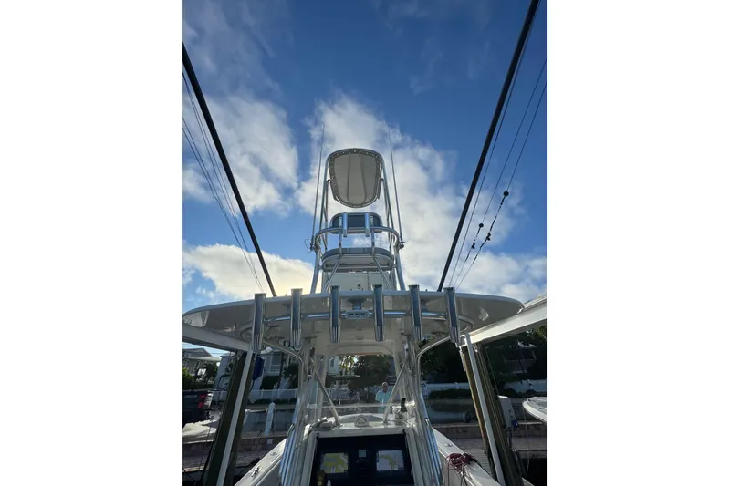 Slide: The Image of 2022 SeaVee 322 Z boat with tower against a blue sky background. - 24
