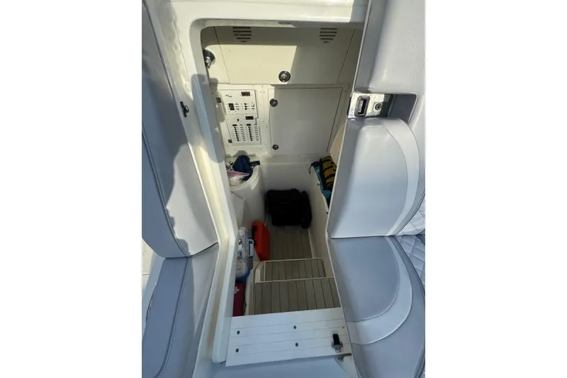 Slide: The Image of 2022 SeaVee 322 Z boat interior with storage and control panel. - 27