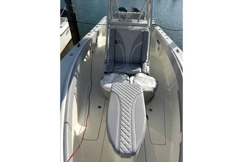 Slide: The Image of 2022 SeaVee 322 Z boat interior with cushioned seating and sleek design. - 5
