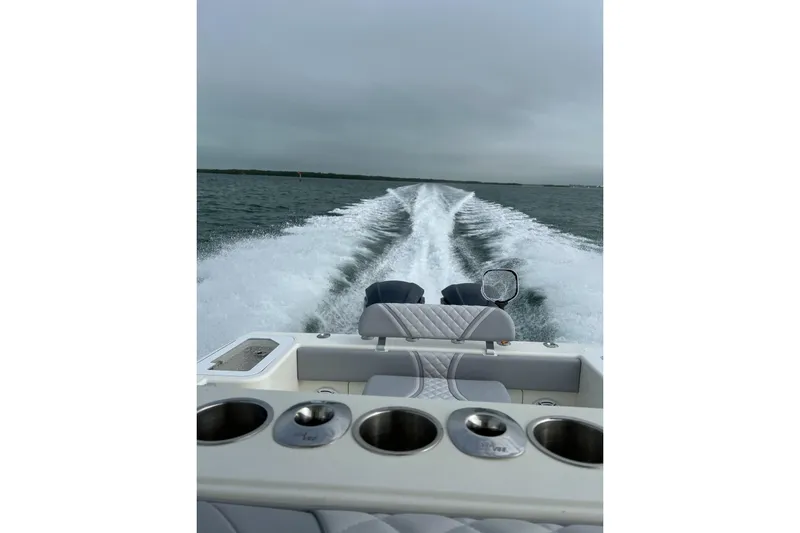 Slide: The Image of 2022 SeaVee 322 Z boat cruising on open water, leaving a wake behind. - 6