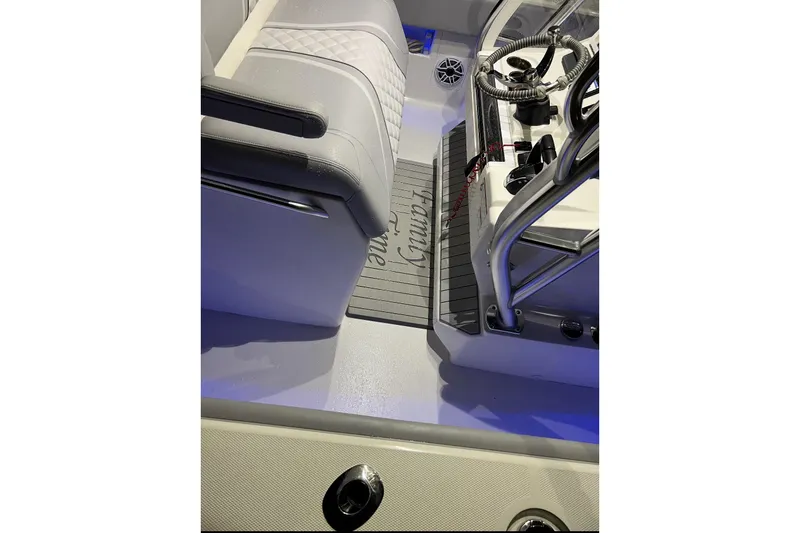 Slide: The Image of 2022 SeaVee 322 Z boat interior with steering wheel and seating. - 8