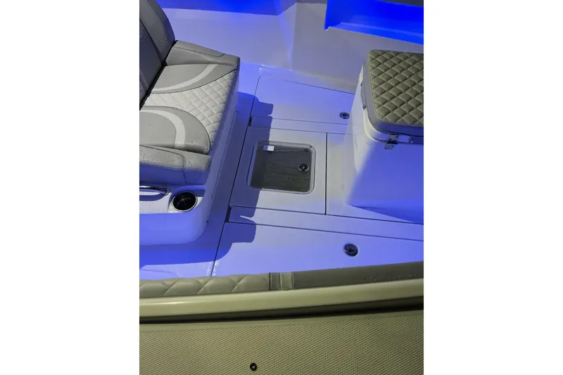 Slide: The Image of Interior of 2022 SeaVee 322 Z boat with cushioned seating and storage area. - 9