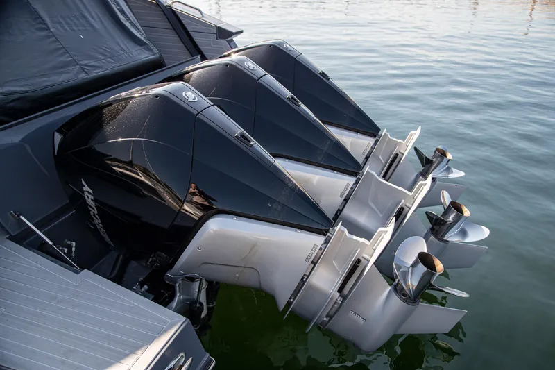 Slide: The Image of 2024 Cruisers Yachts 38 GLS OB with triple outboard engines on water. - 2