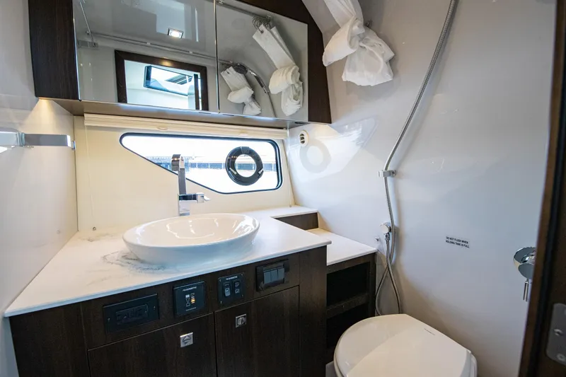 Slide: The Image of Luxurious bathroom interior of 2024 Cruisers Yachts 38 GLS OB with modern fixtures. - 21