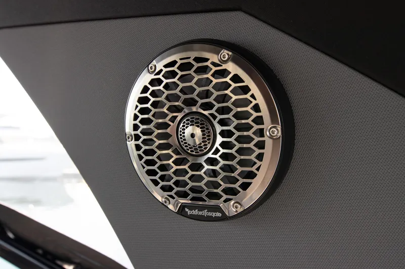Slide: The Image of Speaker detail on 2024 Cruisers Yachts 38 GLS OB, featuring hexagonal grille design. - 23