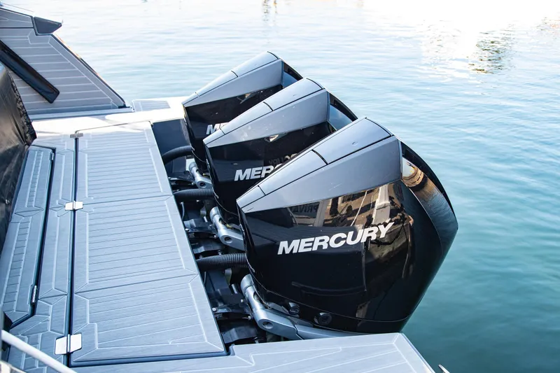 Slide: The Image of 2024 Cruisers Yachts 38 GLS OB with triple Mercury outboard engines on water. - 26