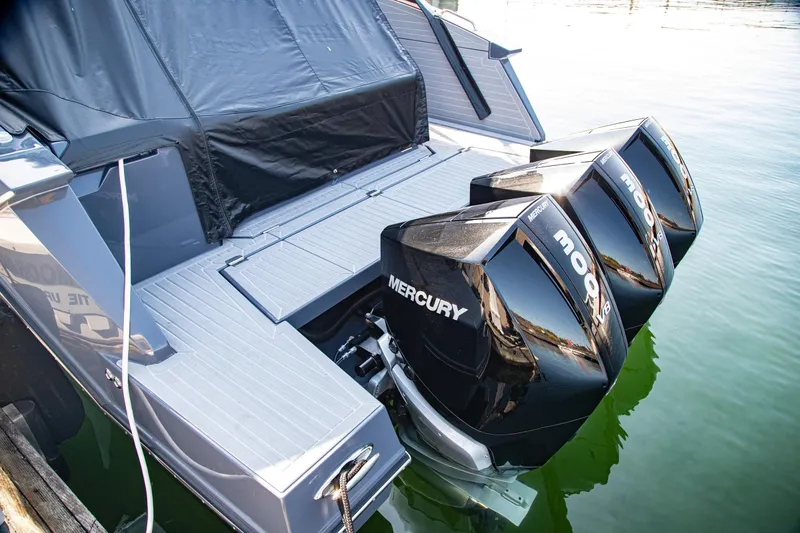 Slide: The Image of 2024 Cruisers Yachts 38 GLS OB with triple Mercury outboard engines on water. - 27