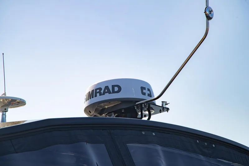 Slide: The Image of 2024 Cruisers Yachts 38 GLS OB radar equipment against clear sky. - 28