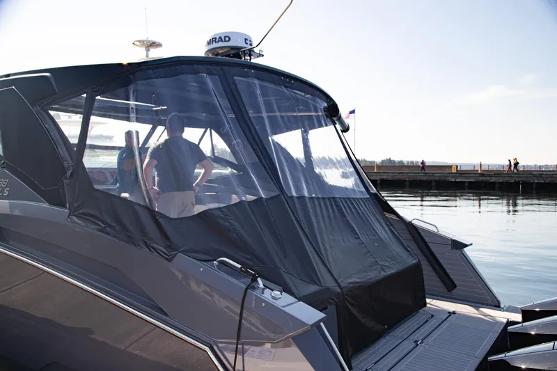 Slide: The Image of 2024 Cruisers Yachts 38 GLS OB at dock, featuring sleek design and covered cockpit. - 29