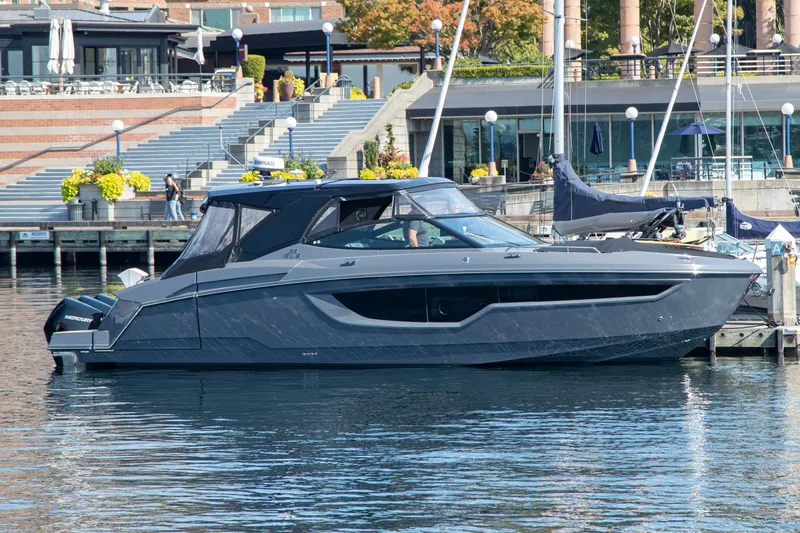 Slide: The Image of 2024 Cruisers Yachts 38 GLS OB docked at a marina, showcasing sleek design and modern features. - 31