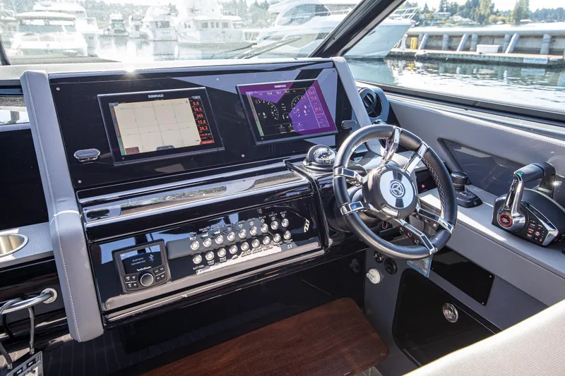Slide: The Image of 2024 Cruisers Yachts 38 GLS OB helm with advanced navigation displays and controls. - 6